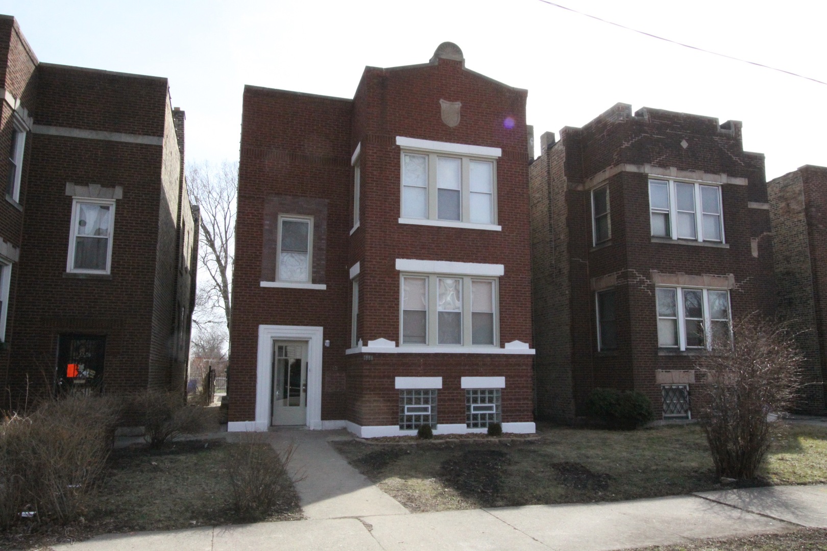 111 West 74th Street Chicago, IL 60621 - Photo 1 of 10 a front view of a building with pathway