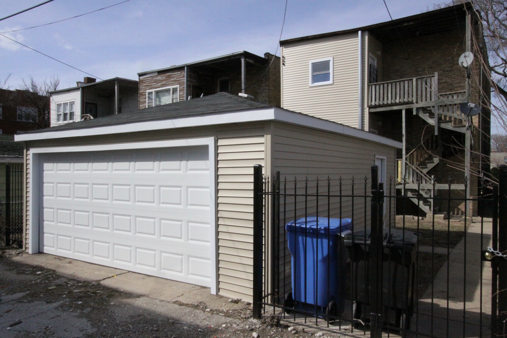 111 West 74th Street Chicago, IL 60621 - Photo 2 of 10 a front view of a house with parking space