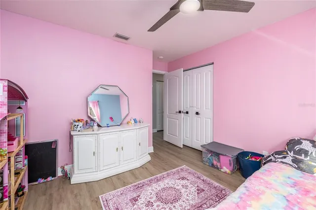 a bed room with a bed and a television