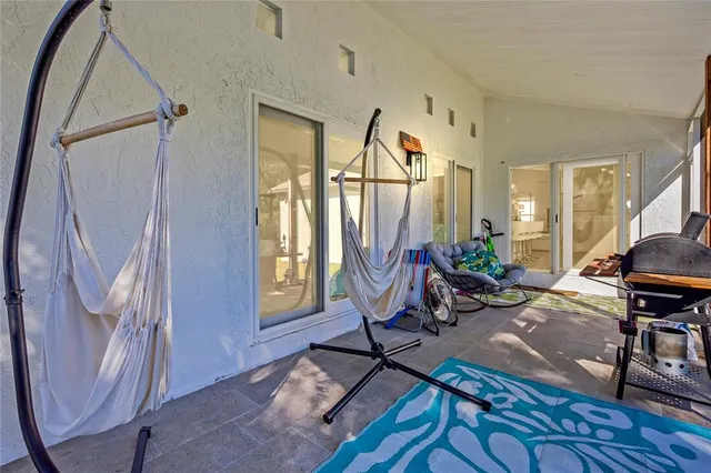 a living room filled with furniture and a window