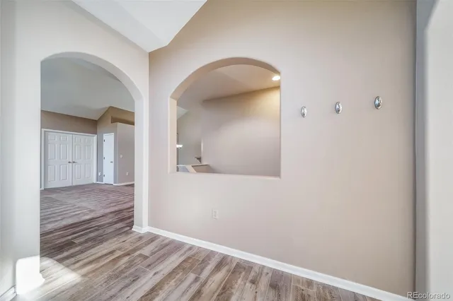 a living room with furniture flat screen tv and a fireplace
