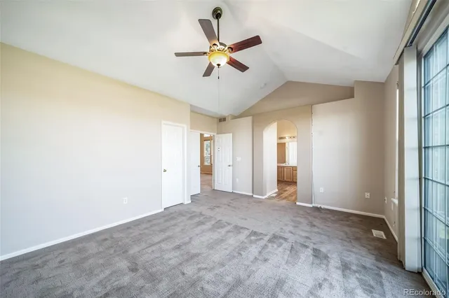 a view of a roof with wooden floor and fence