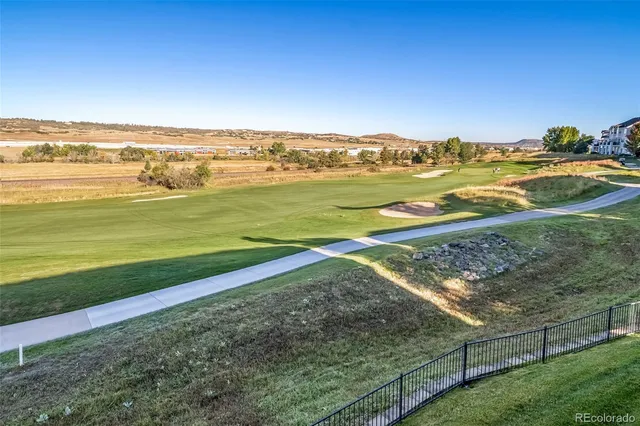 a spacious bathroom with a granite countertop sink mirror and bathtub