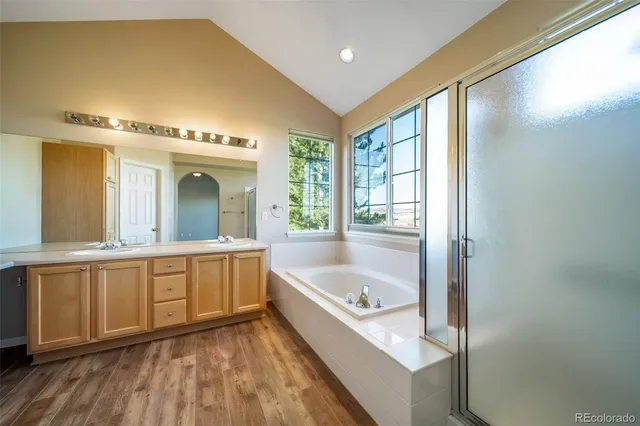a bathroom with a bathtub and a shower