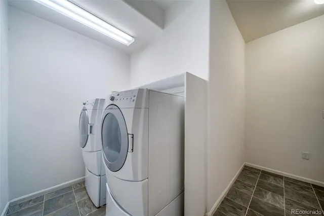 a view of a swimming pool with a garden and outdoor seating