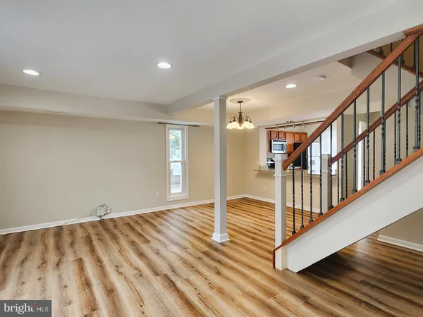 a view of an empty room with stairs