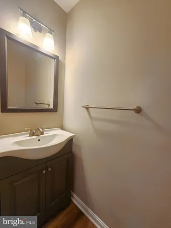 a bathroom with a sink and mirror