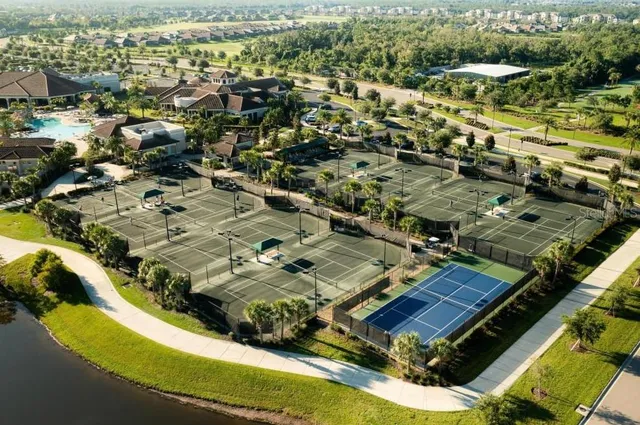 an aerial view of residential houses with outdoor space