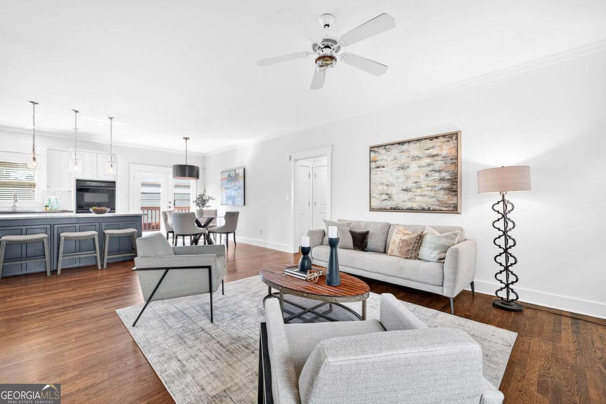 4492 Oakdale Road Southeast Smyrna, GA 30080 - Photo 11 of 37 a living room with furniture wooden floor and kitchen view
