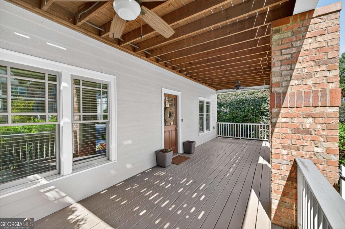 4492 Oakdale Road Southeast Smyrna, GA 30080 - Photo 2 of 37 a view of balcony with wooden floor and floor to ceiling window