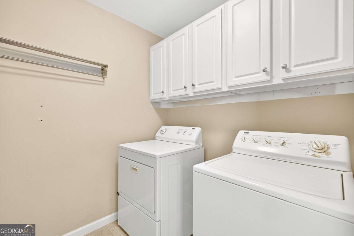 4492 Oakdale Road Southeast Smyrna, GA 30080 - Photo 22 of 37 a utility room with dryer and washer