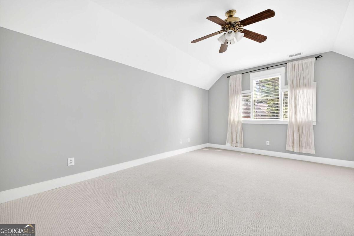 4492 Oakdale Road Southeast Smyrna, GA 30080 - Photo 23 of 37 a view of room with ceiling fan and window