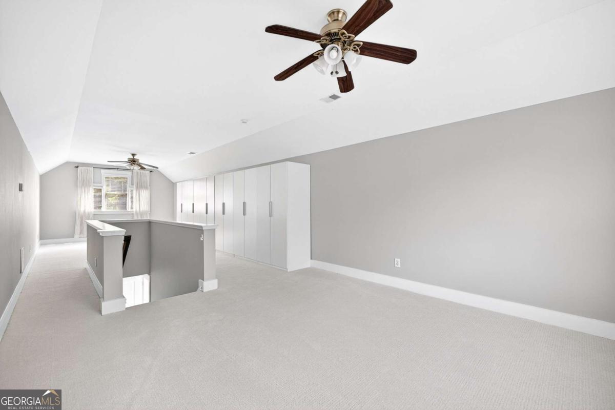 4492 Oakdale Road Southeast Smyrna, GA 30080 - Photo 24 of 37 a view of a livingroom with a staircase