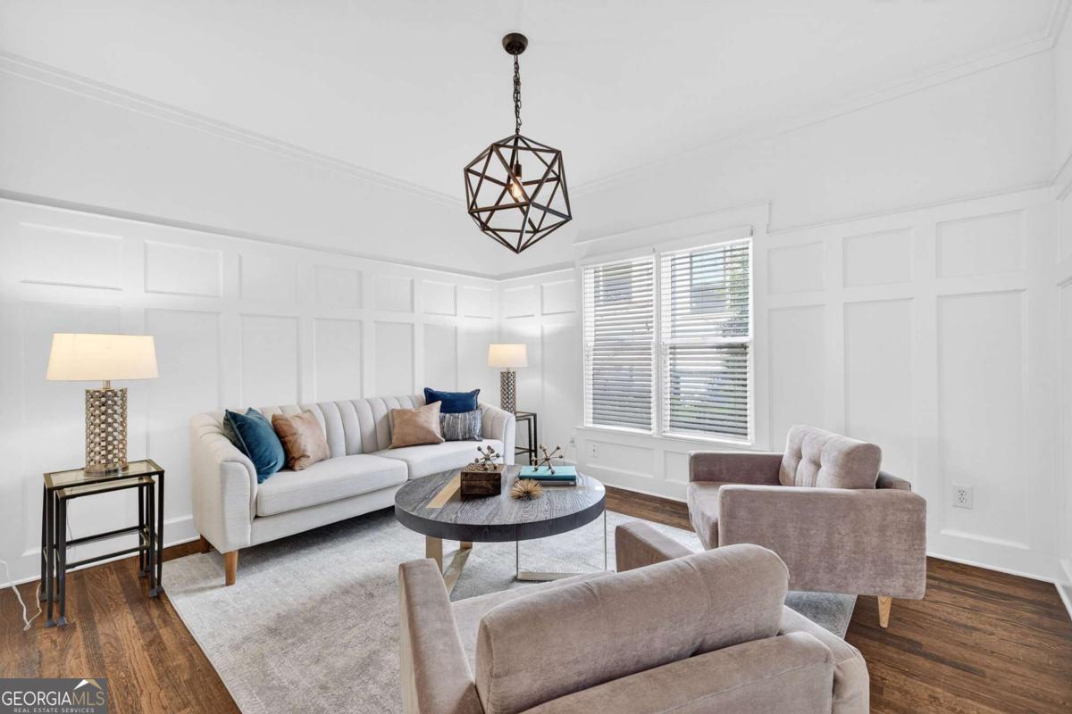 4492 Oakdale Road Southeast Smyrna, GA 30080 - Photo 3 of 37 a living room with furniture wooden floor and a table