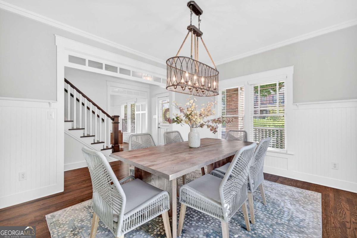 4492 Oakdale Road Southeast Smyrna, GA 30080 - Photo 6 of 37 a view of a dining room with furniture window and wooden floor