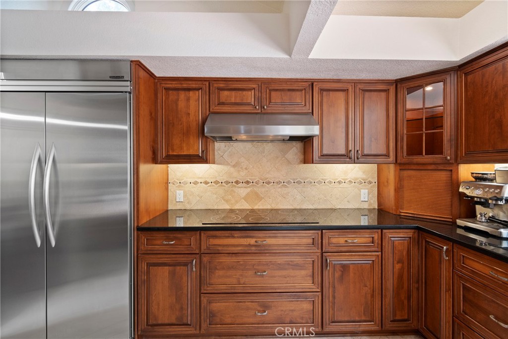 24741 Eldamar Avenue Lake Forest, CA 92630 - Photo 12 of 67 a kitchen with granite countertop stainless steel appliances and wooden cabinets