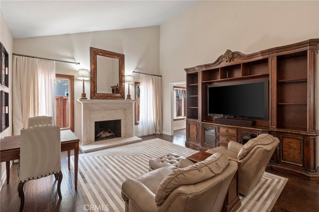 24741 Eldamar Avenue Lake Forest, CA 92630 - Photo 16 of 67 a bedroom with furniture and a flat screen tv