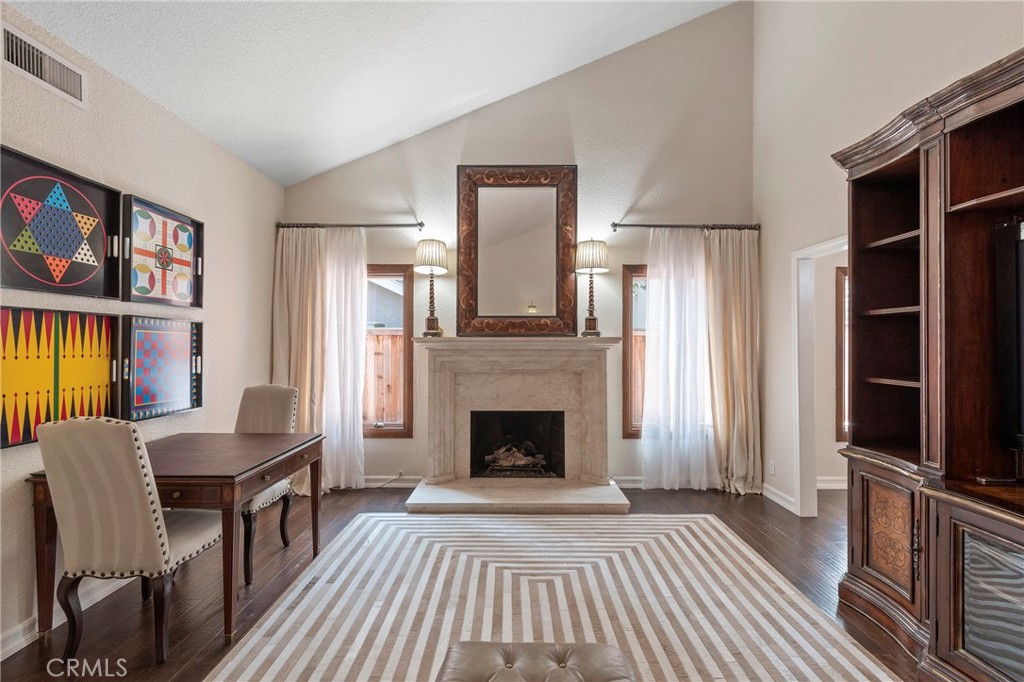 24741 Eldamar Avenue Lake Forest, CA 92630 - Photo 17 of 67 a living room with furniture fireplace and flat screen tv