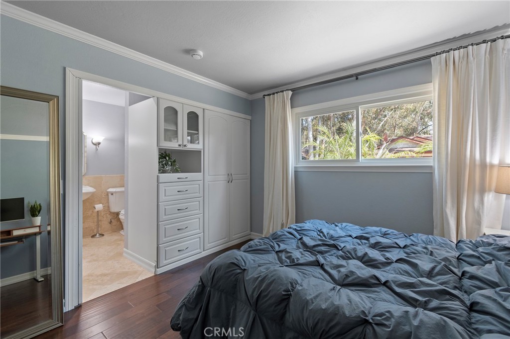 24741 Eldamar Avenue Lake Forest, CA 92630 - Photo 22 of 67 a bedroom with a bed and a window