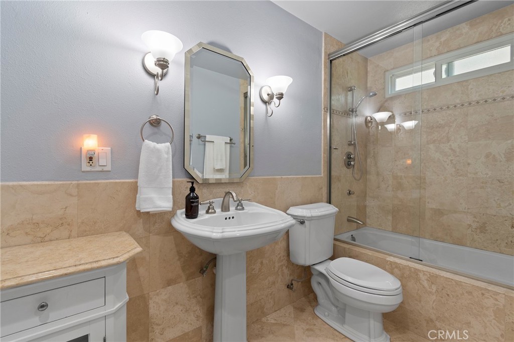 24741 Eldamar Avenue Lake Forest, CA 92630 - Photo 23 of 67 a bathroom with a sink toilet and shower