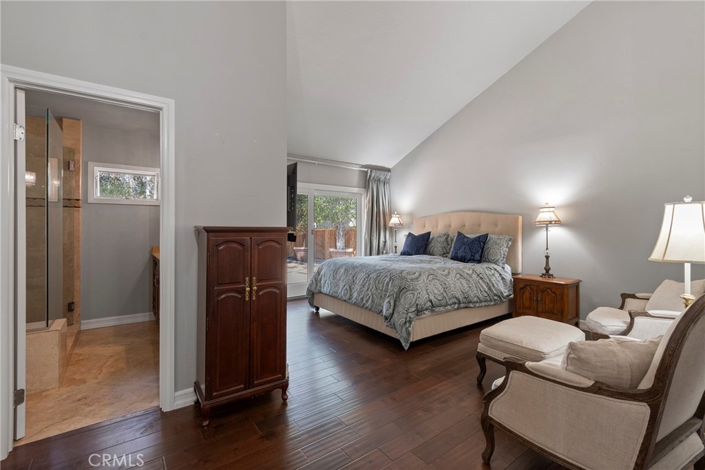 24741 Eldamar Avenue Lake Forest, CA 92630 - Photo 24 of 67 a bedroom with a bed and wooden floor