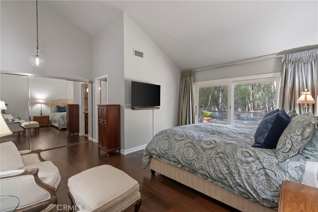 24741 Eldamar Avenue Lake Forest, CA 92630 - Photo 25 of 67 a bedroom with a bed a large window and furniture