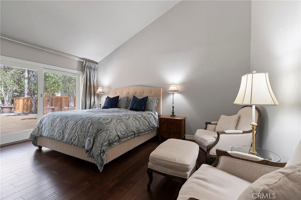 24741 Eldamar Avenue Lake Forest, CA 92630 - Photo 27 of 67 a bedroom with a bed and a lamp