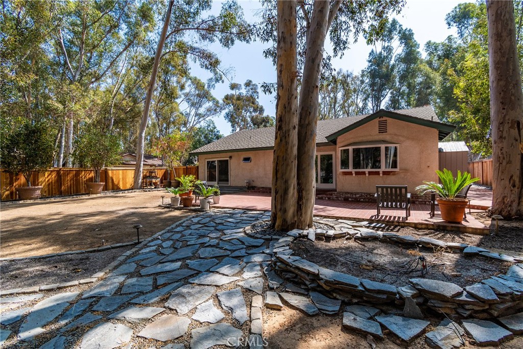 24741 Eldamar Avenue Lake Forest, CA 92630 - Photo 29 of 67 a front view of a house with a yard and a tree