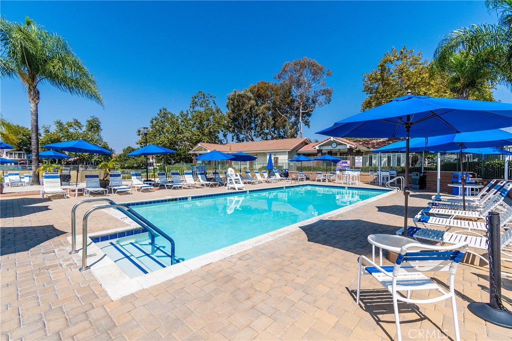 24741 Eldamar Avenue Lake Forest, CA 92630 - Photo 38 of 67 a view of a swimming pool with chairs in patio