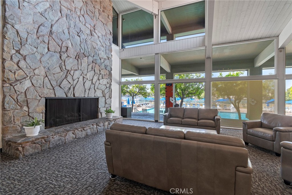 24741 Eldamar Avenue Lake Forest, CA 92630 - Photo 48 of 67 a living room with furniture a flat screen tv and a fireplace
