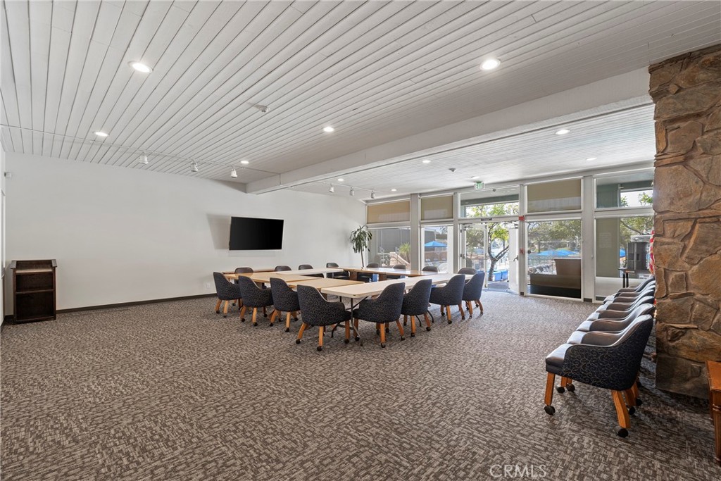 24741 Eldamar Avenue Lake Forest, CA 92630 - Photo 49 of 67 a living room with lots of furniture and a table