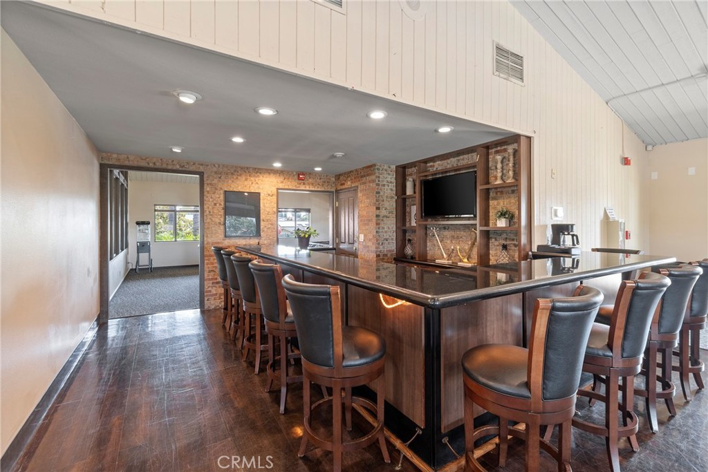 24741 Eldamar Avenue Lake Forest, CA 92630 - Photo 51 of 67 a kitchen with stainless steel appliances granite countertop a dining table chairs and granite counter tops