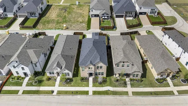 a aerial view of a house with garden and plants