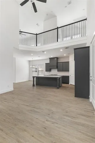 a view of kitchen with furniture and a hallway