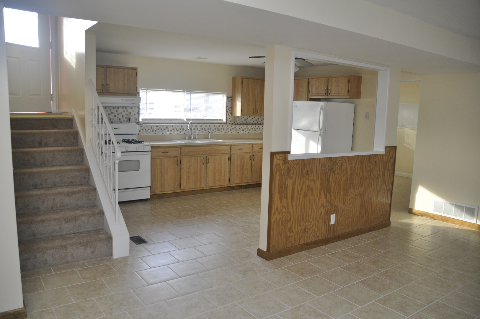 49 Pueblo Road Montgomery, IL 60538 - Photo 17 of 35 a view of a kitchen with a sink cabinets and a window