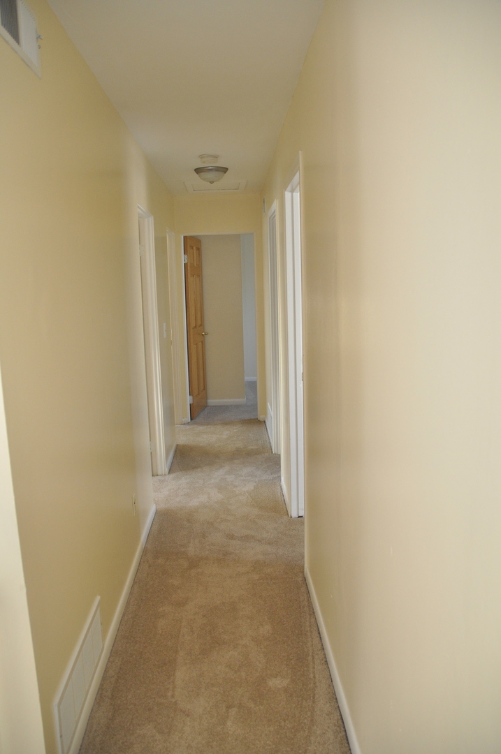 49 Pueblo Road Montgomery, IL 60538 - Photo 30 of 35 a view of a hallway with wooden floor