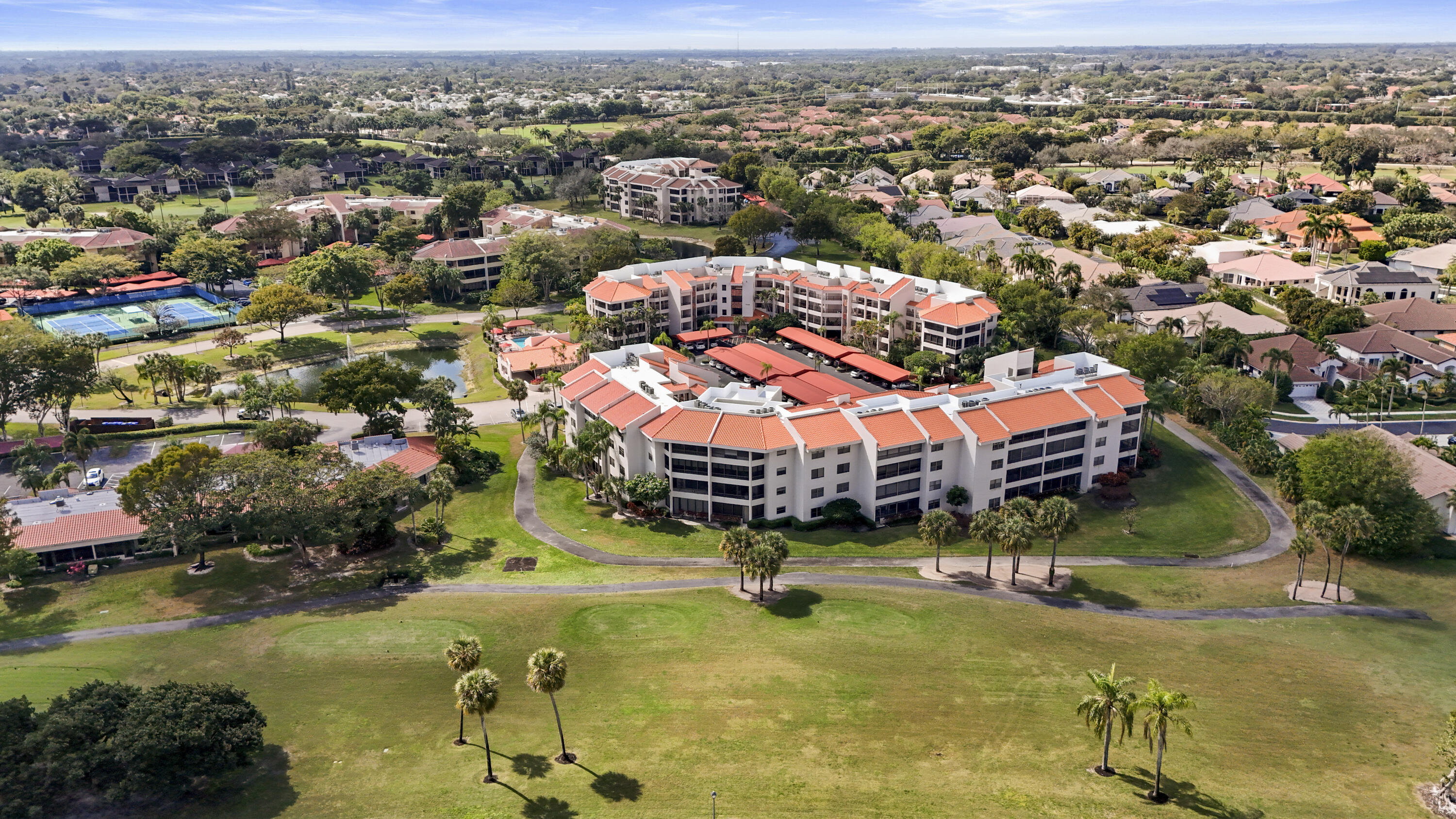 7507 La Paz Boulevard, Unit 407 Boca Raton, FL 33433 - Photo 26 of 31 an aerial view of residential houses with outdoor space