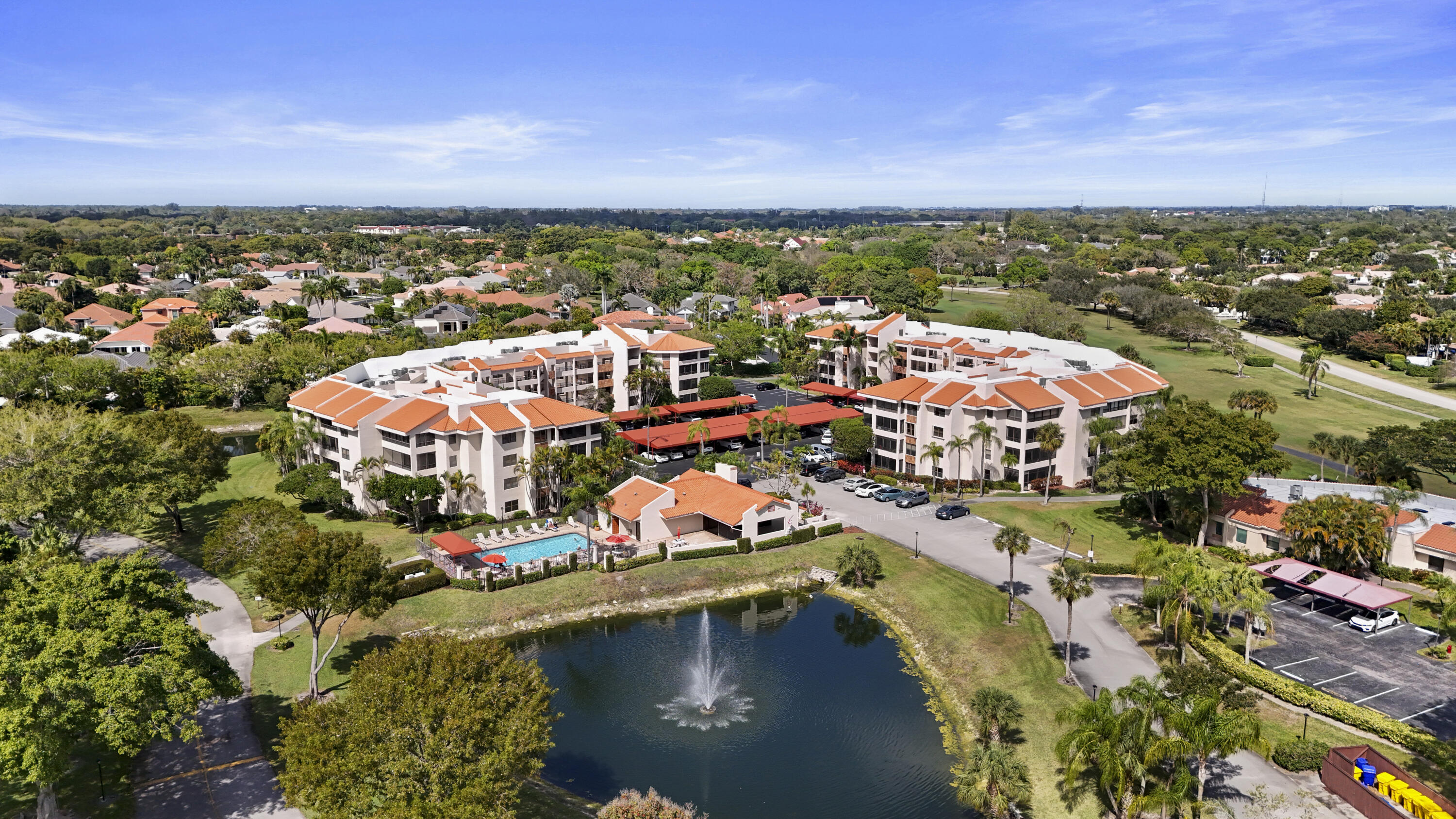7507 La Paz Boulevard, Unit 407 Boca Raton, FL 33433 - Photo 29 of 31 an aerial view of residential houses with outdoor space