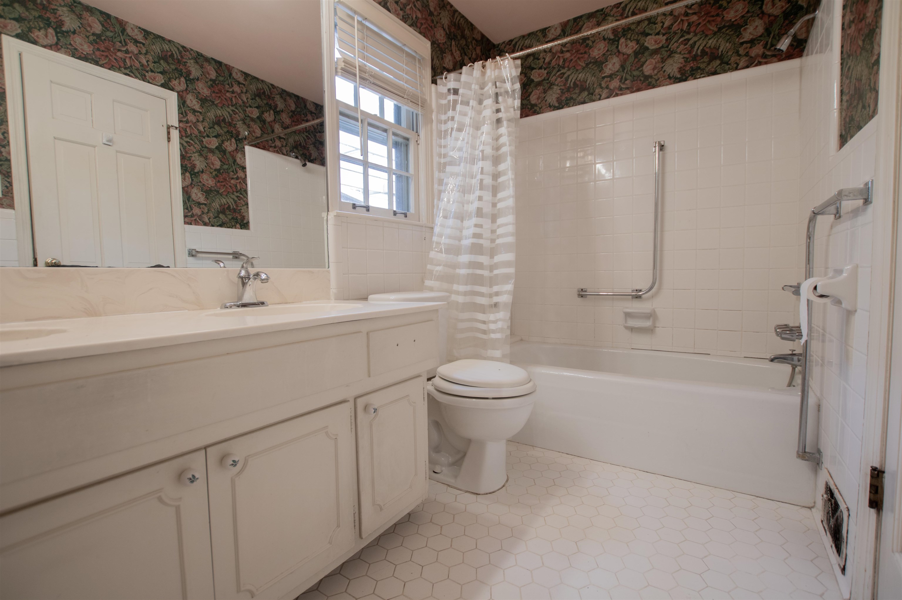 320 South Yates Road Memphis, TN 38120 - Photo 12 of 14 a bathroom with a double vanity sink toilet and shower