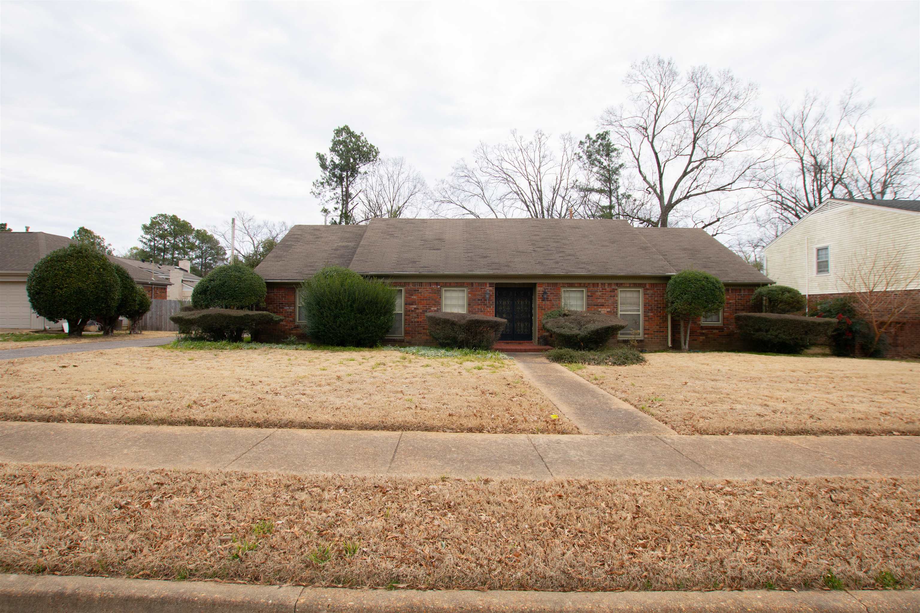 320 South Yates Road Memphis, TN 38120 - Photo 5 of 14 a front view of a house with a yard