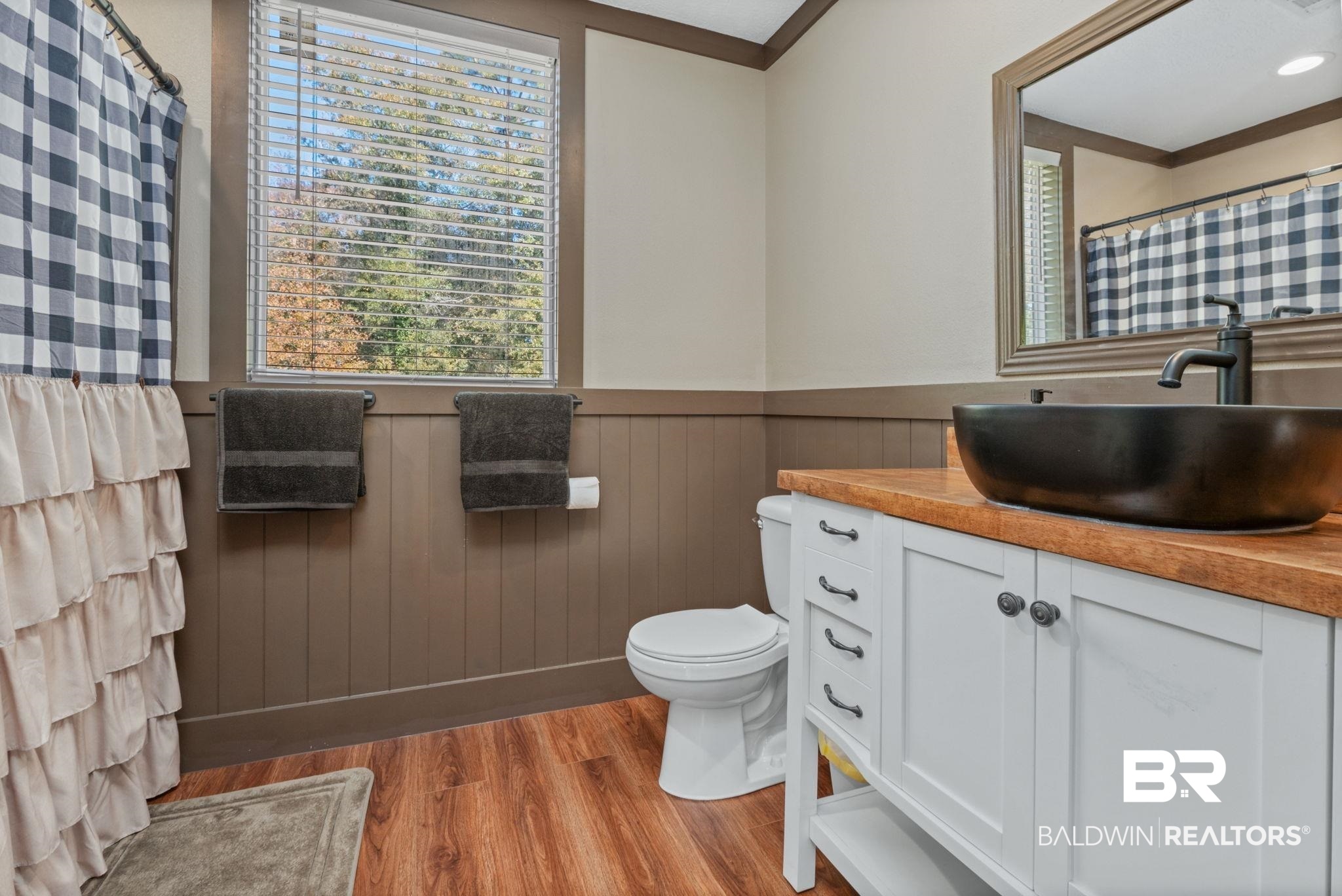 15080 Starlight Avenue Wilmer, AL 36587 - Photo 25 of 29 Bathroom featuring vanity, hardwood / wood-style floors, and toilet