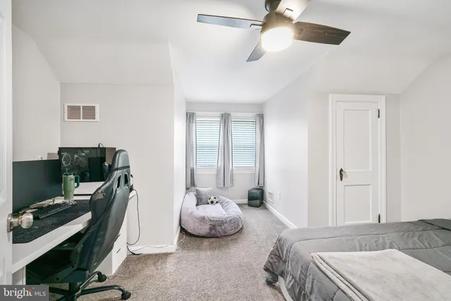 a bedroom with a large bed and a couch