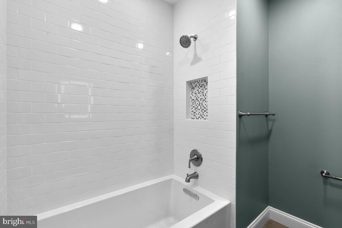 1506 Noyes Drive Silver Spring, MD 20910 - Photo 22 of 51 a bathroom with a bathtub and shower