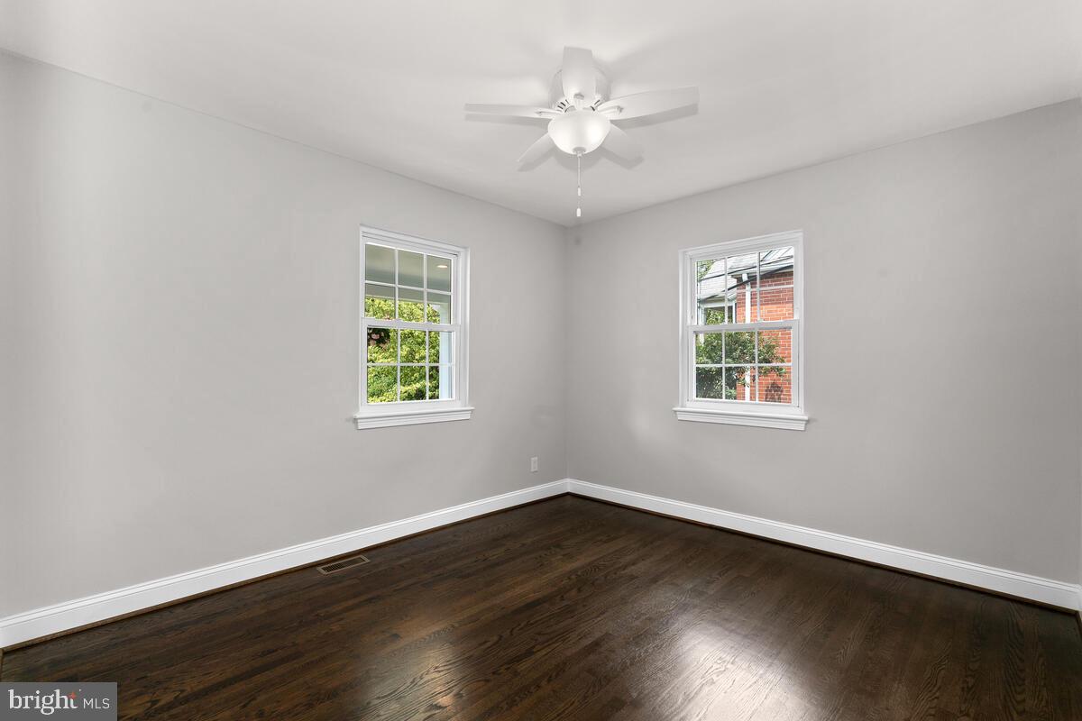 1506 Noyes Drive Silver Spring, MD 20910 - Photo 24 of 51 a view of an empty room with wooden floor and a window