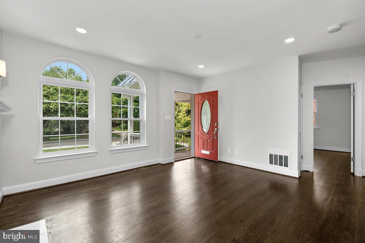1506 Noyes Drive Silver Spring, MD 20910 - Photo 26 of 51 a view of an empty room with wooden floor and a window