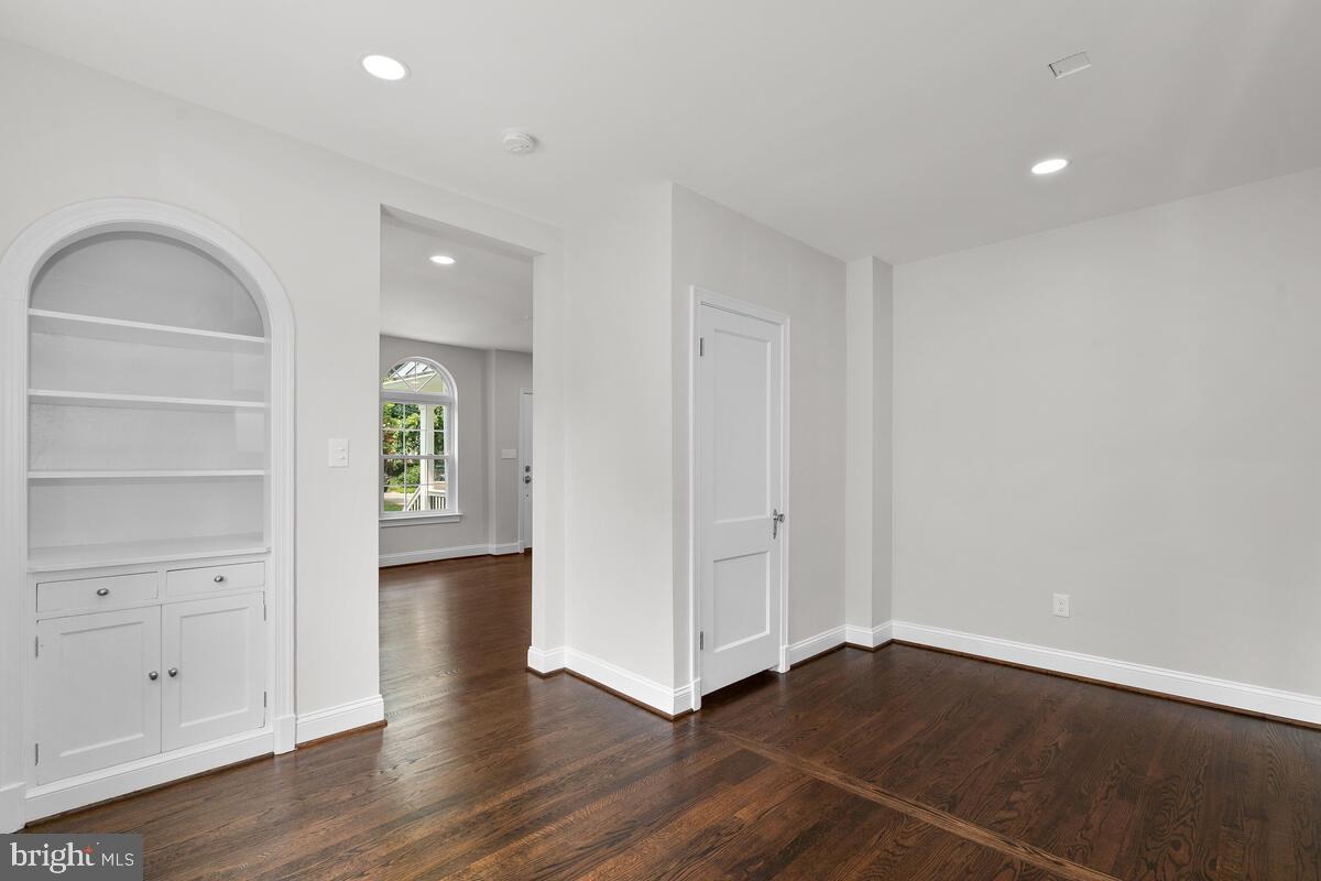 1506 Noyes Drive Silver Spring, MD 20910 - Photo 27 of 51 a view of an empty room with wooden floor and a window