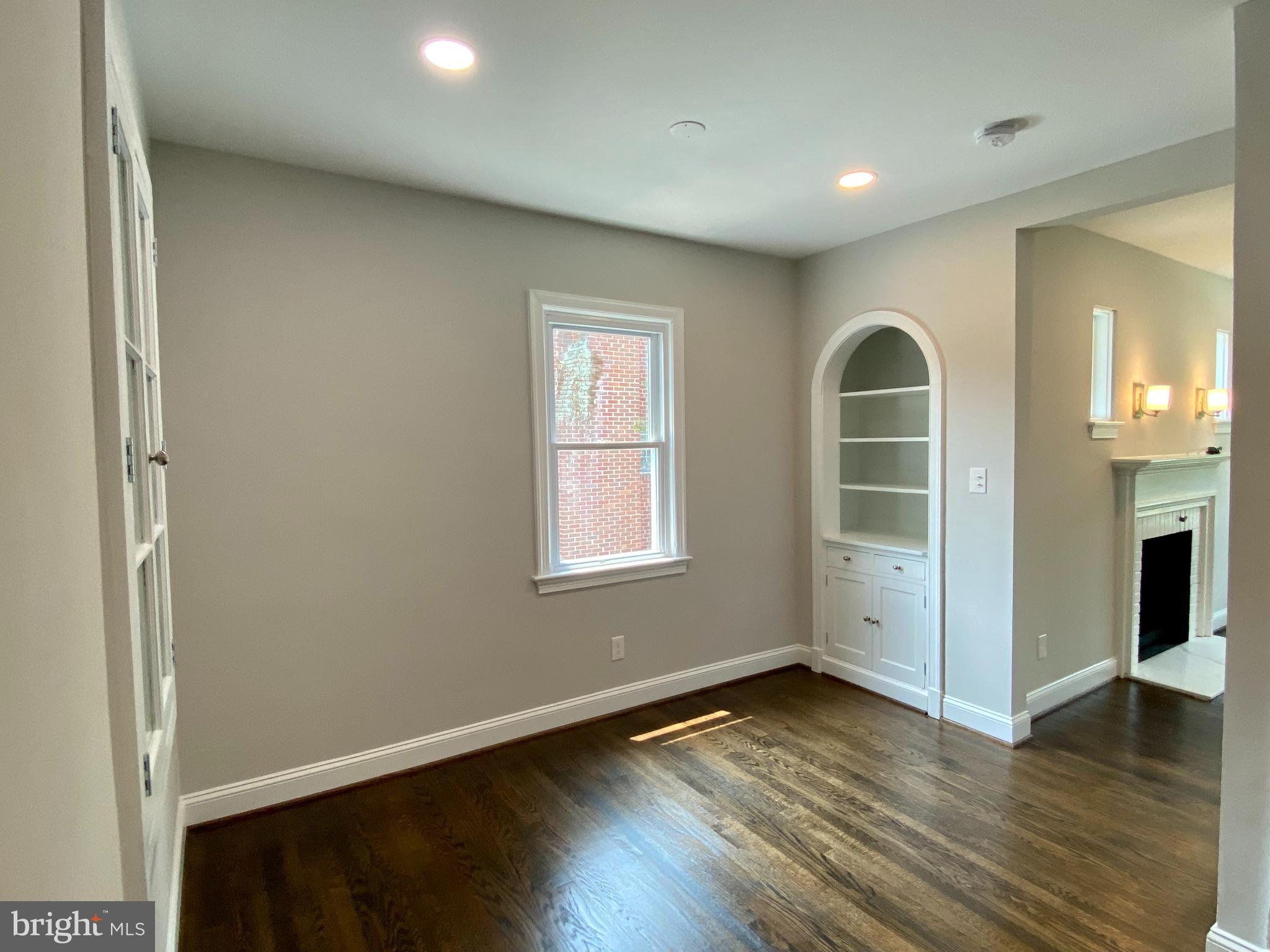 1506 Noyes Drive Silver Spring, MD 20910 - Photo 28 of 51 an empty room with wooden floor and windows