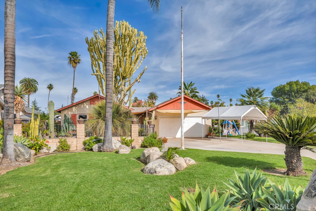 a front view of a house with garden