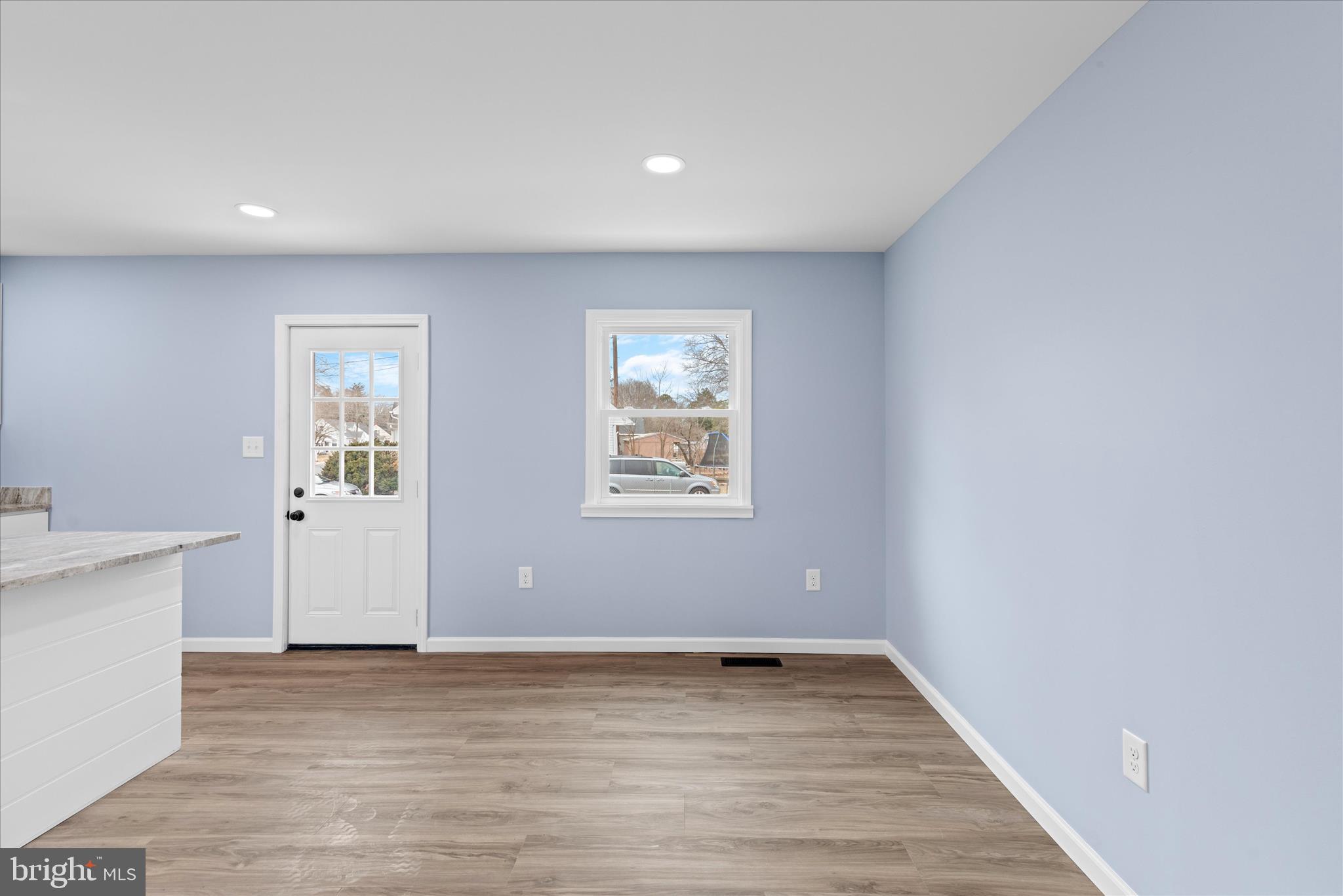 908 Spring Avenue Salisbury, MD 21804 - Photo 11 of 39 a view of an empty room with wooden floor and a window