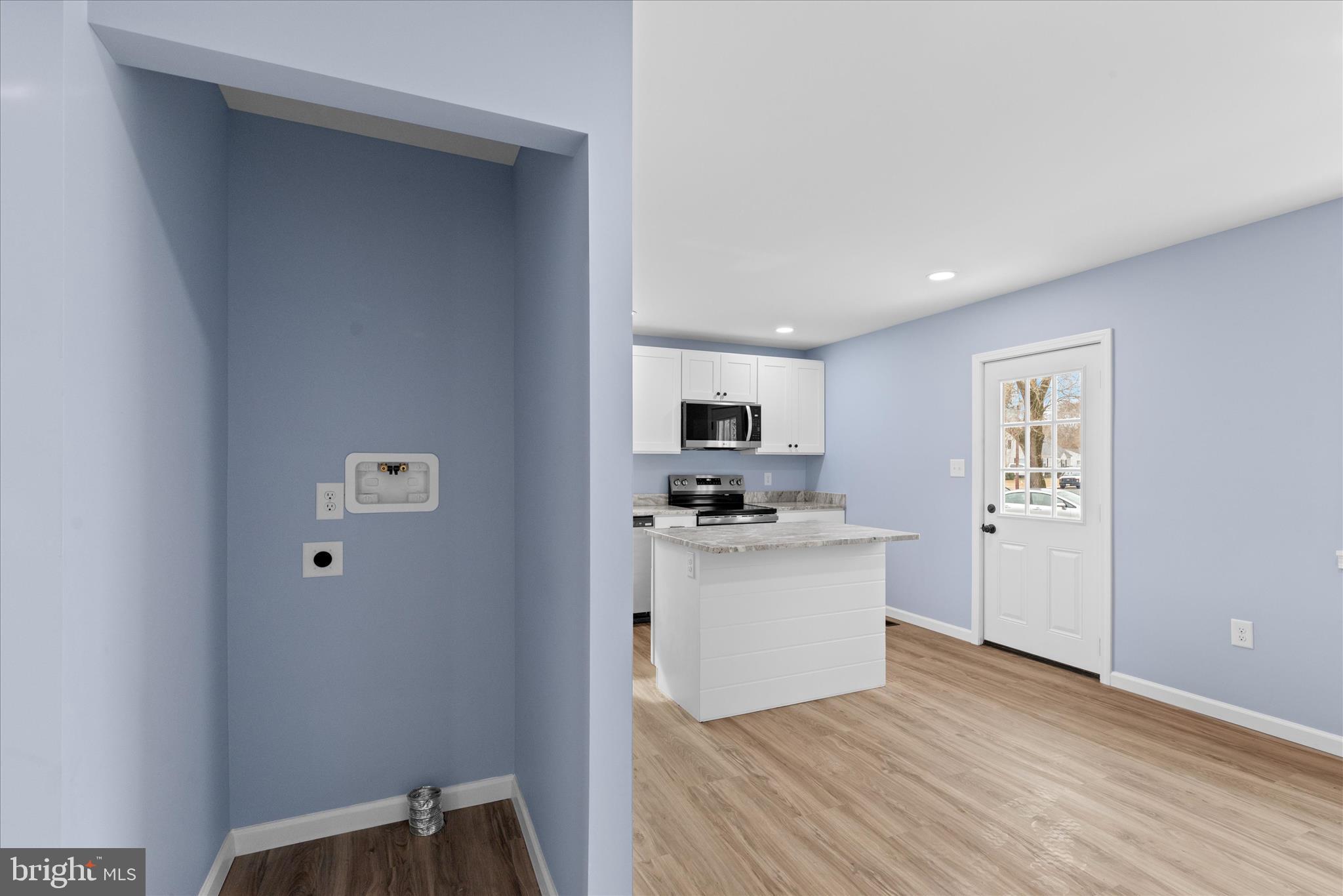 908 Spring Avenue Salisbury, MD 21804 - Photo 14 of 39 a kitchen with stainless steel appliances a refrigerator and a stove top oven